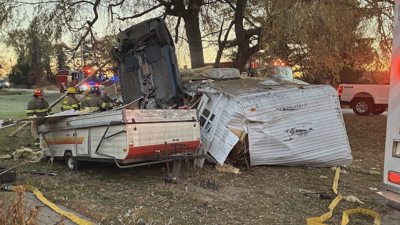Vehicle lands on front end after hitting camper in Sidney.