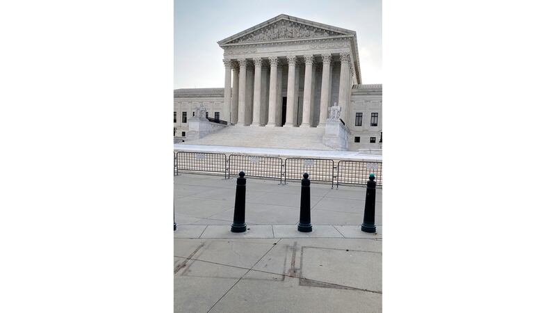 Security fencing around the U.S. Supreme Court is shown removed on Capitol Hill in Washington,...
