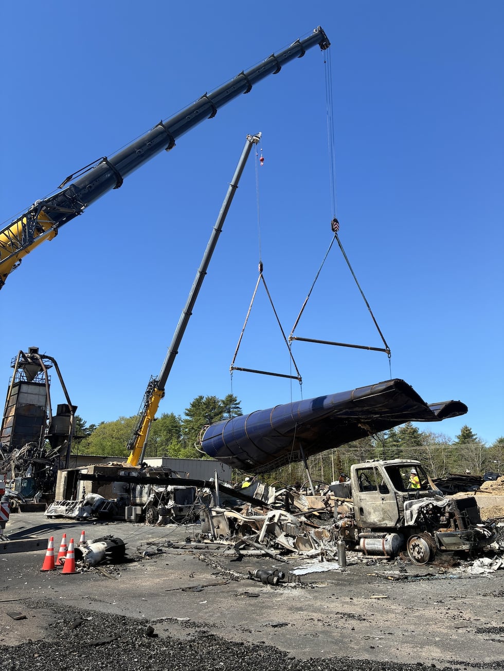 Crane lifts remains of silo from Robbins Lumber grounds