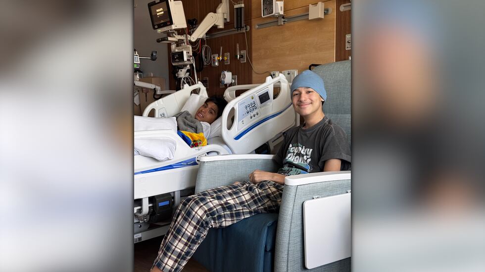 Camilo Henao (left) and J.P. Thomas sit inside a hospital room at Children's Healthcare of...