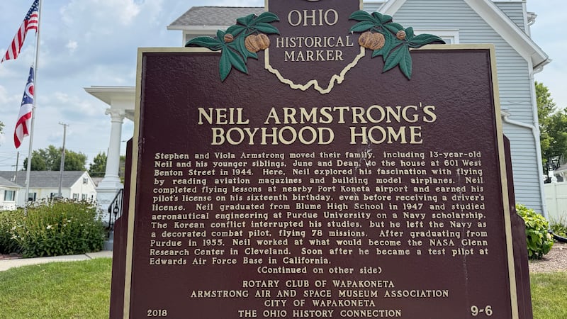 An Ohio historical landmark sign is displayed outside the former home of Neil Armstrong...