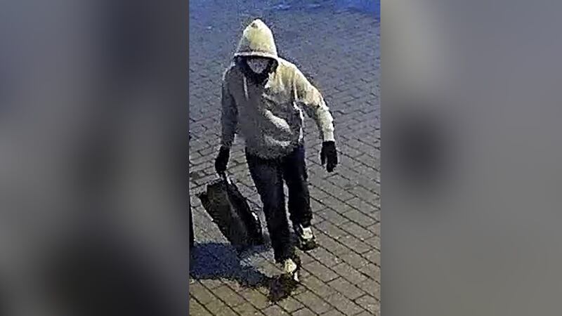 An image is shown of a suspect sought for allegedly placing pipe bombs in Washington on Jan....