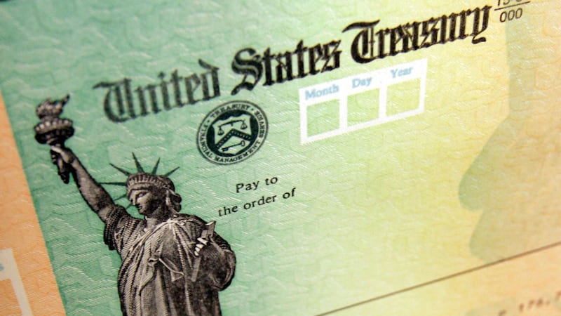 FILE - This May 8, 2008, file photo shows blank checks on an idle press at the Philadelphia...